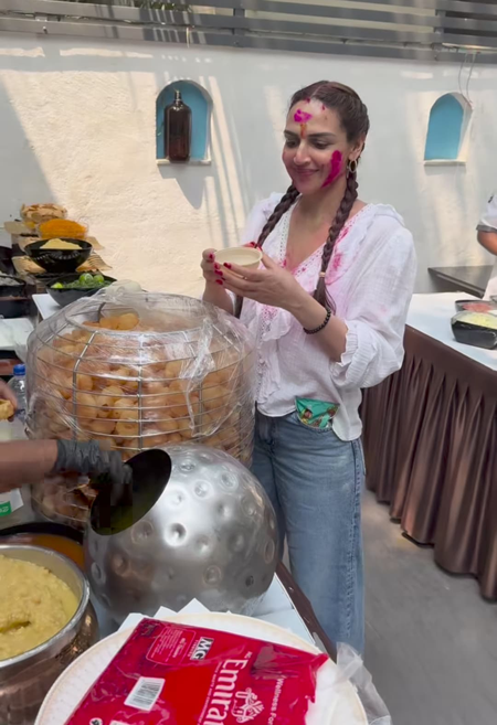 Esha Deol savors some yummy Pani Puri during Holi celebration