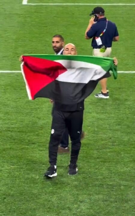 Egypt coach raises Palestinian flag after his side’s first knockout win at a FIFA WC