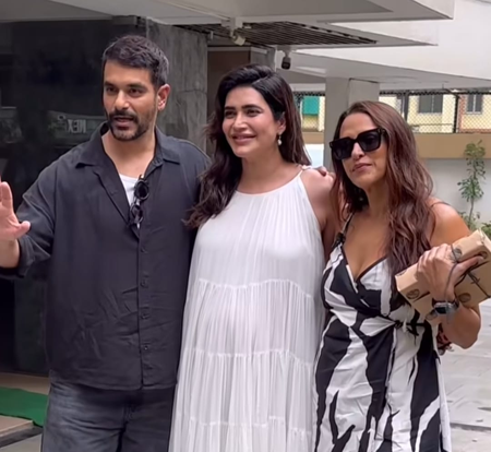 Karishma Tanna asks paps to stop focusing on her baby bump as she poses with Neha Dhupia, Angad Bedi