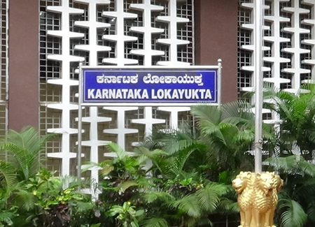 Karnataka Lokayukta raids multiple officials, recovers cash, gold & 80 liquor bottles